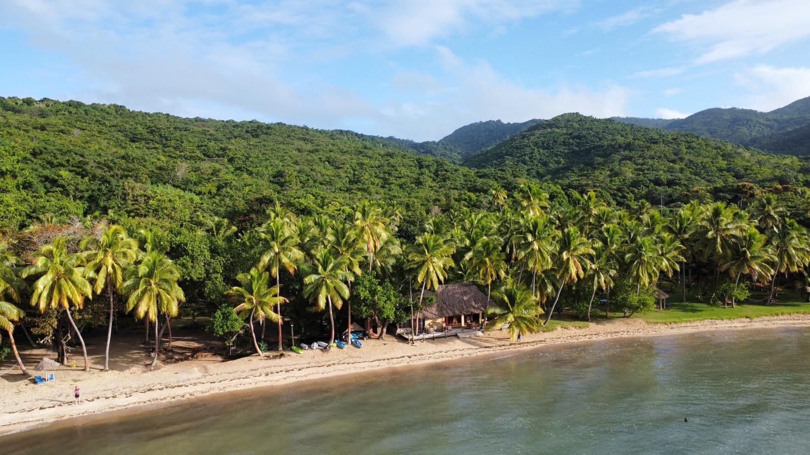 Lush rainforest coastline and calm bay on Kadavu Island, Fiji